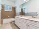 Bathroom features a double sink vanity and a shower/tub combo with tiled surround at 10504 Echo Lake Dr, Odessa, FL 33556