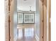 Bright bedroom featuring plantation shutters and hardwood floors at 10504 Echo Lake Dr, Odessa, FL 33556