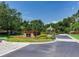 Community entrance with lush landscaping and signage at 10504 Echo Lake Dr, Odessa, FL 33556