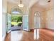 Spacious foyer with hardwood floors, arched doorways, and natural light at 10504 Echo Lake Dr, Odessa, FL 33556