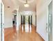Elegant foyer with hardwood floors, decorative columns, and arched doorways at 10504 Echo Lake Dr, Odessa, FL 33556