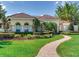 Stunning home with a beautiful lawn, lush landscaping, and a charming walkway at 10504 Echo Lake Dr, Odessa, FL 33556