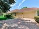 Spacious three-car garage and brick-paved driveway for ample parking at 10504 Echo Lake Dr, Odessa, FL 33556