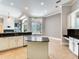 Modern kitchen featuring an island, stainless appliances and granite counters plus lots of natural light at 10504 Echo Lake Dr, Odessa, FL 33556