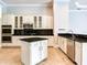 Modern kitchen featuring stainless steel appliances and an island at 10504 Echo Lake Dr, Odessa, FL 33556