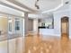 Bright living area with hardwood floors, and sliding doors to an outdoor entertaining area at 10504 Echo Lake Dr, Odessa, FL 33556