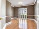 Neutral-toned living room boasts hardwood floors, bright windows, and elegant trim at 10504 Echo Lake Dr, Odessa, FL 33556