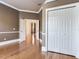 Living room featuring hardwood floors, neutral walls, and an open doorway at 10504 Echo Lake Dr, Odessa, FL 33556