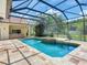 Beautiful pool with attached spa and screened enclosure, perfect for year-round enjoyment and relaxation at 10504 Echo Lake Dr, Odessa, FL 33556
