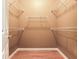 Spacious walk-in closet with wooden flooring and wire shelving at 10504 Echo Lake Dr, Odessa, FL 33556