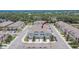 Aerial view of townhome community, showcasing well-maintained landscaping and convenient parking at 10907 Golden Acorn Ave, Tampa, FL 33610