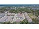 Aerial view of townhome community, showcasing well-maintained landscaping and convenient parking at 10907 Golden Acorn Ave, Tampa, FL 33610
