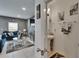 Stylish bathroom featuring a pedestal sink and a peek into the living room at 10907 Golden Acorn Ave, Tampa, FL 33610