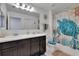 Bright bathroom with double sinks, spacious vanity and tub/shower combo perfect for Gathering at 10907 Golden Acorn Ave, Tampa, FL 33610