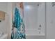 Stylish bathroom with tub and shower combo, offers a blend of comfort and modern design at 10907 Golden Acorn Ave, Tampa, FL 33610