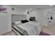 Well-lit bedroom features soft carpet, neutral decor, and ample space for rest and relaxation at 10907 Golden Acorn Ave, Tampa, FL 33610