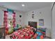 Colorful bedroom with playful decorations and lots of space to play at 10907 Golden Acorn Ave, Tampa, FL 33610