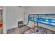 Bedroom with a blue bunk bed with sports-themed bedding and white walls, perfect for children at 10907 Golden Acorn Ave, Tampa, FL 33610