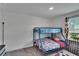 Bright bedroom with bunk beds, window views, and soft carpet, perfect for restful nights at 10907 Golden Acorn Ave, Tampa, FL 33610