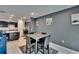 Open dining area with modern furnishings, flowing seamlessly from the kitchen and featuring contemporary decor at 10907 Golden Acorn Ave, Tampa, FL 33610
