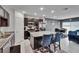 Open-concept kitchen featuring a granite island, stainless steel appliances, and seamless flow to the dining area at 10907 Golden Acorn Ave, Tampa, FL 33610