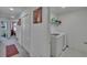 Upstairs hallway features closet laundry area with new washer and dryer at 10907 Golden Acorn Ave, Tampa, FL 33610