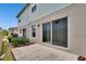 A charming patio area with access to the backyard is accessible from a large sliding glass door at 10907 Golden Acorn Ave, Tampa, FL 33610