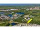 A picturesque aerial view of beautiful homes nestled among lush greenery with scenic water views and recreational ponds at 11510 Quiet Forest Dr, Tampa, FL 33635
