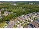 A stunning aerial perspective of a residential area, highlighting the lush greenery and inviting community atmosphere at 11510 Quiet Forest Dr, Tampa, FL 33635