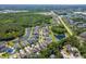 Aerial view of a Primary-planned community with homes, lakes, and lush landscaping. Some homes feature private pools at 11510 Quiet Forest Dr, Tampa, FL 33635