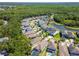 A tranquil neighborhood view featuring a community pond, mature trees, and beautifully landscaped properties at 11510 Quiet Forest Dr, Tampa, FL 33635