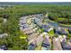 A tranquil neighborhood view featuring a community pond, mature trees, and beautifully landscaped properties at 11510 Quiet Forest Dr, Tampa, FL 33635
