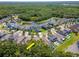 A high-angle showcases a lovely residential community with a pond, green spaces and well-maintained homes at 11510 Quiet Forest Dr, Tampa, FL 33635