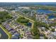 An aerial view shows beautiful homes near ponds surrounded by lush greenery and modern residential developments at 11510 Quiet Forest Dr, Tampa, FL 33635