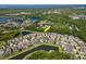 Beautiful aerial view of a residential community featuring lush landscaping and serene lakes at 11510 Quiet Forest Dr, Tampa, FL 33635