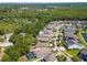 A captivating aerial view captures a well-planned residential community with manicured lawns and verdant trees at 11510 Quiet Forest Dr, Tampa, FL 33635