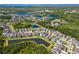 Aerial view of a lovely neighborhood with community lakes and lush greenery at 11510 Quiet Forest Dr, Tampa, FL 33635