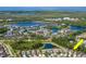 Aerial shot of the beautiful homes in a lakeside community, surrounded by lush green trees at 11510 Quiet Forest Dr, Tampa, FL 33635