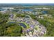 Aerial view of a lovely neighborhood with community lakes and lush greenery at 11510 Quiet Forest Dr, Tampa, FL 33635