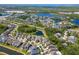 Beautiful aerial view of a well-maintained neighborhood with lush landscaping, ponds, and homes with modern architecture at 11510 Quiet Forest Dr, Tampa, FL 33635