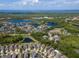 A scenic aerial shot displays a residential community with multiple ponds, green spaces and well-maintained homes at 11510 Quiet Forest Dr, Tampa, FL 33635