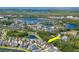 Aerial view of a lovely neighborhood with community lakes and lush greenery; view of the home at 11510 Quiet Forest Dr, Tampa, FL 33635