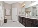 Bathroom features double vanity with granite counters, and marble floors at 11510 Quiet Forest Dr, Tampa, FL 33635