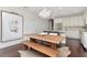 Dining area showcases modern lighting and an open flow to the kitchen and breakfast bar at 11510 Quiet Forest Dr, Tampa, FL 33635