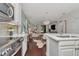 Open-concept kitchen showcasing stainless steel appliances and a seamless transition into the living space at 11510 Quiet Forest Dr, Tampa, FL 33635