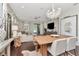 Inviting living room boasting stylish decor, a modern chandelier, and open access to outdoor living spaces at 11510 Quiet Forest Dr, Tampa, FL 33635