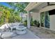Back patio area featuring a fire pit and comfortable seating perfect for outdoor gatherings and relaxation at 11510 Quiet Forest Dr, Tampa, FL 33635