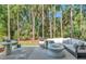 Back patio area featuring a fire pit and comfortable seating perfect for outdoor gatherings and relaxation at 11510 Quiet Forest Dr, Tampa, FL 33635
