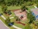 Community playground with swings, slide, and picnic area at 11510 Quiet Forest Dr, Tampa, FL 33635