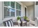 Inviting covered porch with wicker seating offering a cozy outdoor space at 11510 Quiet Forest Dr, Tampa, FL 33635